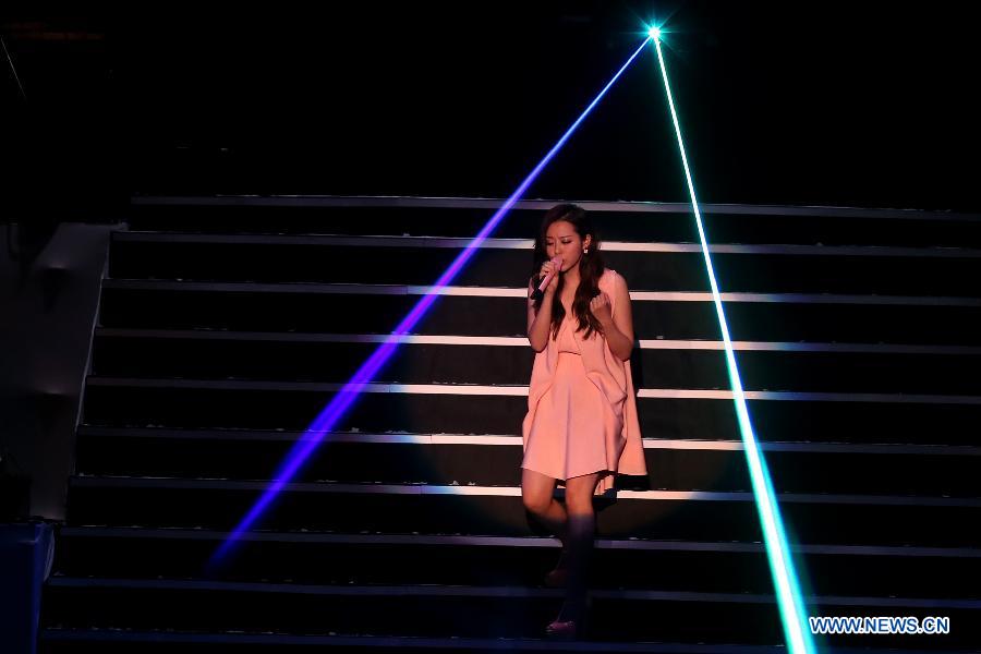 Singer Zhang Liangying performs during a memorial concert for Teresa Teng (1953-1995), one of the most famous pop singers in China, in the Taipei Arena in Taipei, southeast China's Taiwan, May 12, 2013. (Xinhua/Xie Xiudong) 