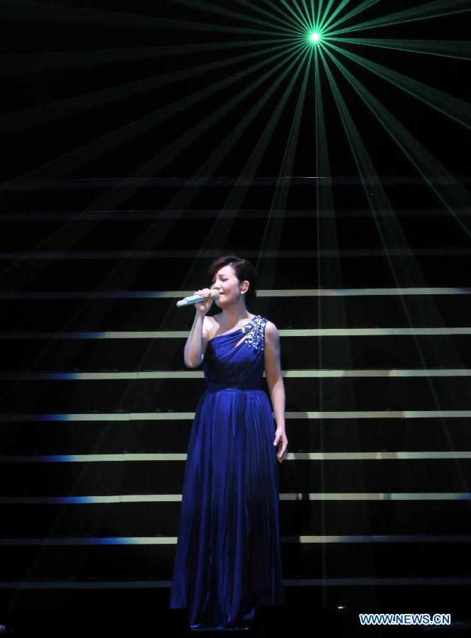 Singer Fish Leong performs during a memorial concert for Teresa Teng held in the Taipei Arena in Taipei, southeast China's Taiwan, May 12, 2013. The concert marks the 18th anniversary of the death and 60th anniversary of the birth of Teresa Teng (1953-1995), one of the most famous pop singers in China. (Xinhua/Wu Ching-teng)