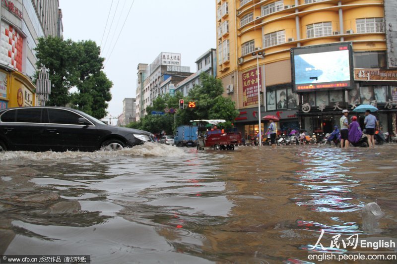 A rainstorm hits Sanya, south China's Hainan province on April 26, 2013. The rain caused waterlogging in some parts of city. Red alert of rainstorm and thunder had been issued by Sanya Meteorological Station.