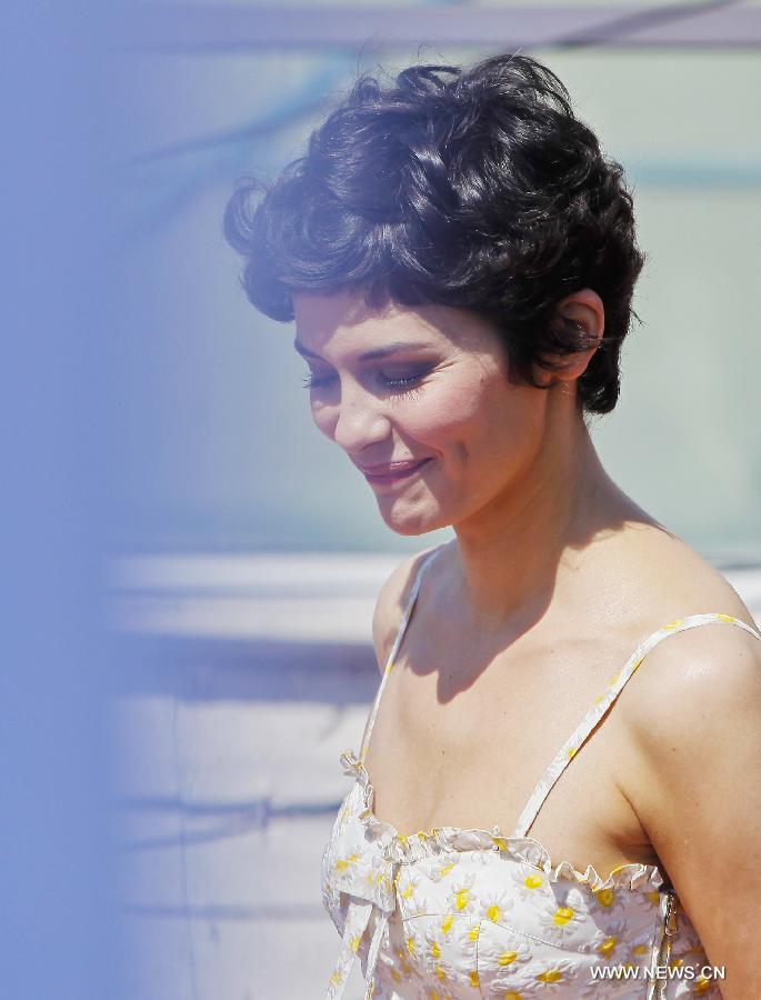 French actress Audrey Tautou arrives for a photocall event one day before the opening of the 66th Cannes Film Festival in Cannes, France, on May 14, 2013. Audrey Tautou will host the opening and closing ceremonies of the Festival this year. (Xinhua/Zhou Lei)