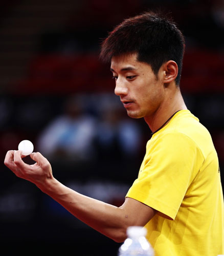 The defending champion of men's singles player Zhang Jike receives training at the Palais Omnisports de Paris-Bercy in Paris, on May 13, 2013. (Photo/Xinhua)