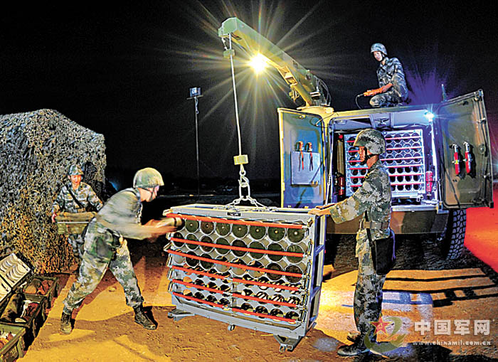 A mechanized infantry regiment under the Jinan Military Area Command (MAC) of the Chinese People's Liberation Army (PLA) organized its officers and men to conduct the drill on such subjects as artillery turret repair, tire replacement and engine repair for infantry combat vehicle and so on the evening of May 3, 2013, in a bid to effectively improve troops’ equipment support capability at night. (Chinamil.com.cn/ Xun Wenchao, Zhang Dongdong and Zhang Dongqing)