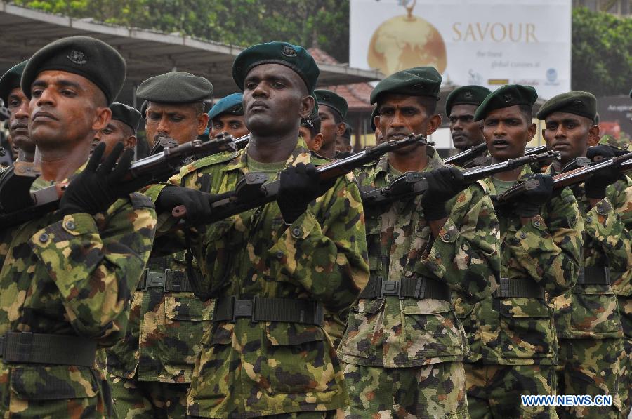 Sri Lankan army personnel march during the Victory Day parade rehearsal in Colombo, capital of Sri Lanka, on May 15, 2013. Sri Lanka celebrates War Heroes Week with a military parade scheduled for May 18. The parade celebrates the fourth anniversary of the defeat of the Tamil Tiger rebels in May 2009, ending a 37-year long separatist conflict. (Xinhua/Sameera)