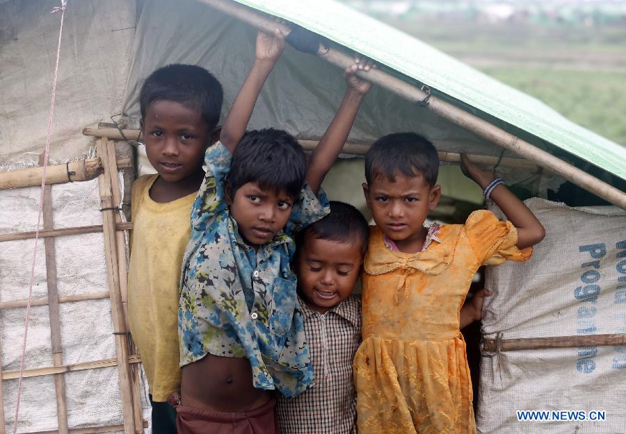 Bengali-Muslim children are seen at Mansi Internally Displaced Persons (IDP) camp near Sittway township in Myanmar's western Rakhine coastal area, on May 15, 2013. The Bengali-Muslims will be evacuated to safer places in wake of possible strike on the country by severe cyclonic storm Mahasen. (Xinhua/U Aung)