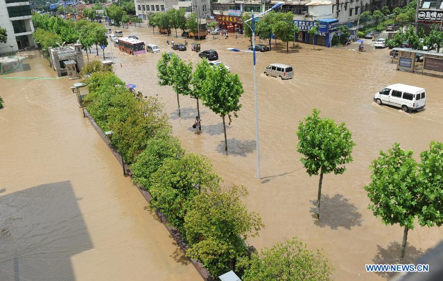 Photo taken on May 14, 2013 shows the flooded Fusheng Road in Nanchang City, capital of east China's Jiangxi Province. A heavy rainfall hit Jiangxi Province on May 14. The average rainfall of the province reached 46.4 millimeters, with that of Nanchang climbing to the highest of 71 millimeters May 15. (Xinhua/Yuan Zheng)