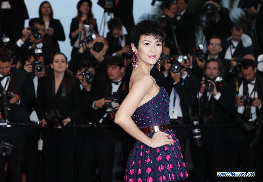 Chinese actress Zhang Ziyi arrives on the red carpet for the opening ceremony of the 66th annual Cannes Film Festival in Cannes, France, May 15, 2013. The festival runs from May 15 to 26. (Xinhua/Gao Jing)