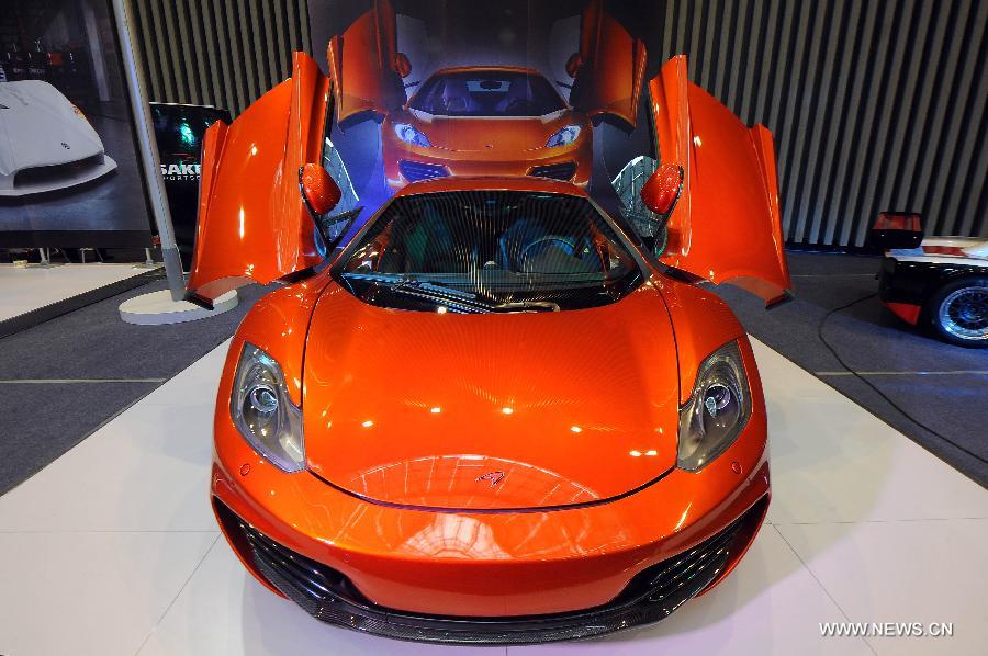 A McLaren sports car is displayed at the 2013 China (Taiyuan) International Automobile Exhibition in Taiyuan, capital of north China's Shanxi Province, May 17, 2013. Some 400 vehicles of 63 brands were taken to the auto show here, which kicked off on May 16. (Xinhua/Fan Minda) 