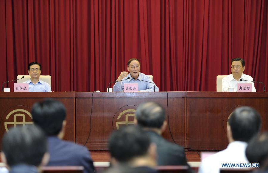 Wang Qishan (C), secretary of the Communist Party of China (CPC) Central Commission for Discipline Inspection, addresses a conference and training session on central-level Party inspection in Beijing, capital of China, May 17, 2013. (Xinhua/Xie Huanchi)