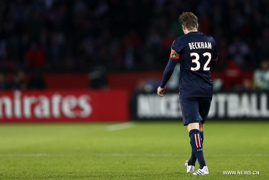 Paris Saint-Germain's English midfielder David Beckham walks on the pitch during the French League 1 football match between Paris St Germain and Brest at Parc des Princes stadium in Paris on May 18, 2013. (Xinhua/Wang Lili)