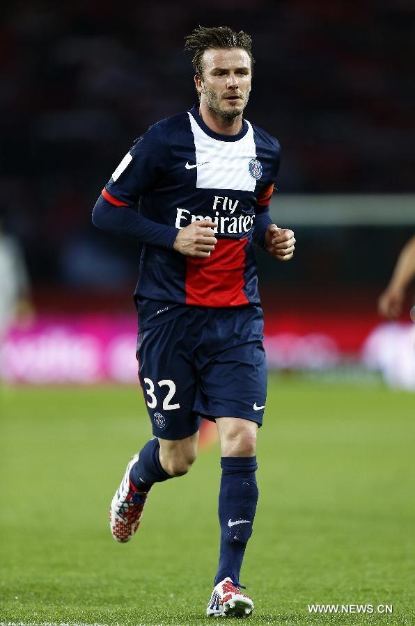 Paris Saint-Germain's English midfielder David Beckham runs for a corner during the French League 1 football match between Paris St Germain and Brest at Parc des Princes stadium in Paris on May 18, 2013.(Xinhua/Wang Lili)