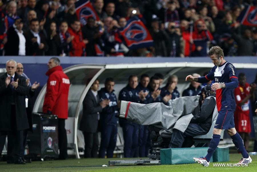 Paris Saint-Germain's English midfielder David Beckham reacts as he is substituted during the French League 1 football match between Paris St Germain and Brest at Parc des Princes stadium in Paris on May 18, 2013.(Xinhua/Wang Lili)