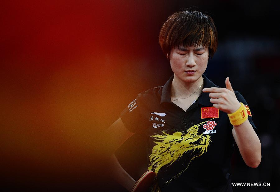 Ding Ning of China reacts during semifinal of women's singles against her teammate Li Xiaoxia at the 2013 World Table Tennis Championships in Paris, France on May 18, 2013. Ding lost 2-4. (Xinhua/Tao Xiyi)