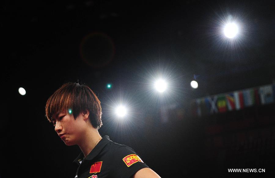 Ding Ning of China reacts during semifinal of women's singles against her teammate Li Xiaoxia at the 2013 World Table Tennis Championships in Paris, France on May 18, 2013. Ding lost 2-4. (Xinhua/Tao Xiyi)