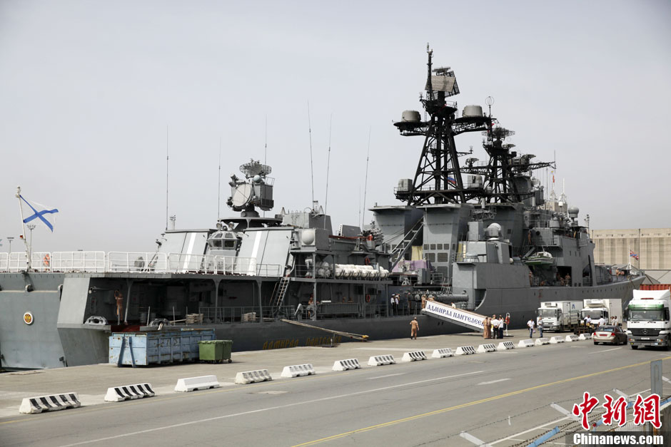Russian sailors are seen aboard the Admiral Panteleyev Russian war ship moored at the Cypriot port of Limassol on Friday, May 17, 2013. Russian naval vessels including the destroyer Admiral Panteleyev, the tanker Pechenga and the rescue tugboat Fotiy Krylov docked at Limassol as part of a four-day visit to the Mediterranean island, Russia's defense ministry said in a statement. The vessels, which are attached to Russia's Pacific fleet, arrived in the Mediterranean sea in recent days as Russia maintains a strong presence in the eastern Mediterranean, especially in light of the civil war now engulfing Syria where Moscow has a key naval base. (Photo Source: chinanews.com)