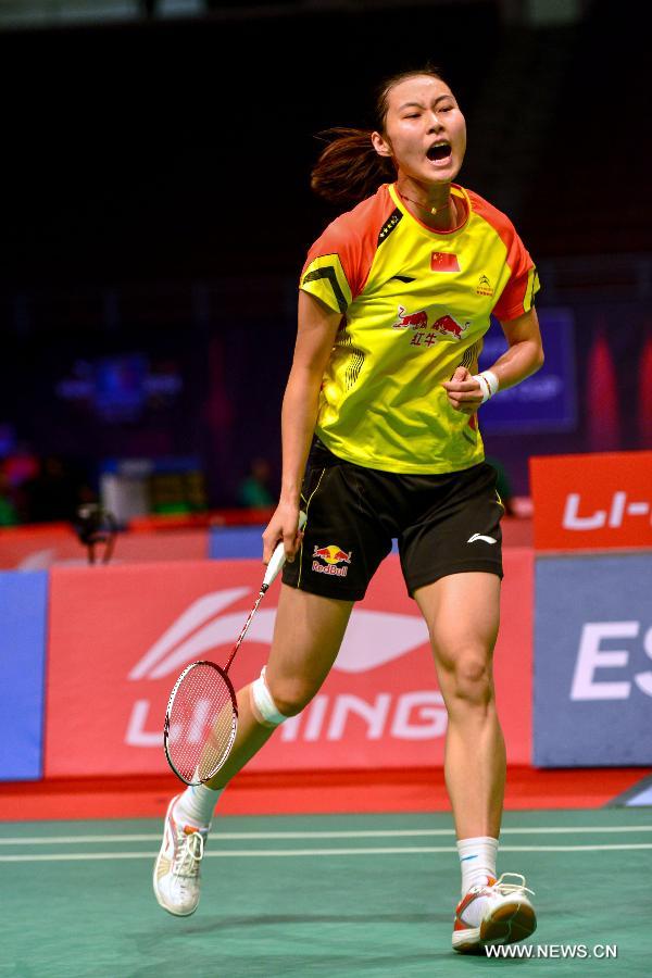 Wang Yihan of China celebrates after winning at the 2013 Sudirman Cup world mixed team badminton championship against India's P.V. Sindhu in Kuala Lumpur, Malaysia, on May 19, 2013. Wang Yihan won 2-1. The Chinese team won 5-0 in total. (Xinhua/Zhang Wenzong)