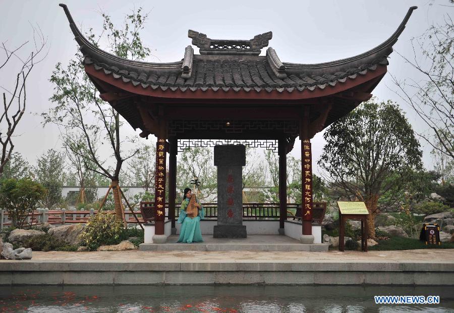 Photo taken on May 18, 2013 shows a view of Hangzhou Park in the 9th China (Beijing) International Garden Expo in Beijing, capital of China. The expo opened in southwestern Fengtai district in Beijing on Saturday and will last till Nov. 18, 2013. Garden designs from 69 Chinese cities and 29 countries will be presented. (Xinhua/Li Wen) 