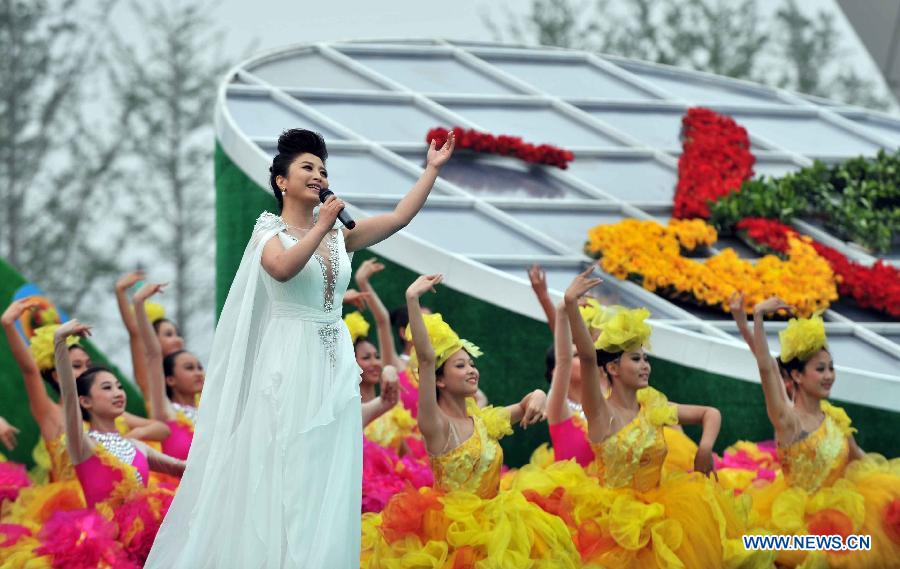 Singer Liu Yuanyuan performs during the opening ceremony of the 9th China (Beijing) International Garden Expo in Beijing, capital of China, May 18, 2013. The expo opened in southwestern Fengtai district in Beijing on Saturday and will last till Nov. 18, 2013. Garden designs from 69 Chinese cities and 29 countries will be presented. (Xinhua/Li Wen) 