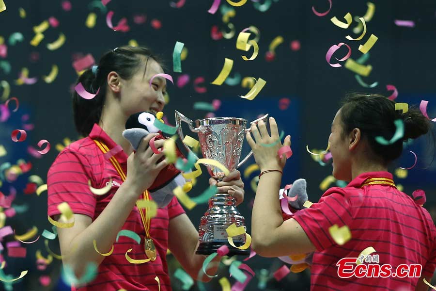 The Chinese women's volleyball team celebrates their victory after beating Puerto Rico in straight sets in Ningbo, Zhejiang Province, May 19, 2013. The Chinese team, which was formed last week, proved a class above their opponents and won the match 25-12, 25-20, 25-14 in just one hour and 11 minutes at the Beilun International Volleyball Tournament.(CNS/Fu Tian)