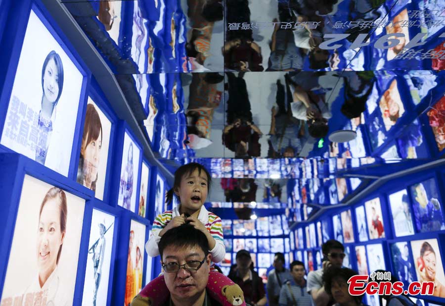 Photos telling the pupation structure and the migration of the Taiwanese are exhibited at the Taiwan Garden of the Garden Expo Park in Fengtai District, Beijing, May 19, 2013. The Ninth China (Beijing) International Garden Expo kicked off on Saturday. Garden designs from 69 Chinese cities and 29 countries will be presented. (CNS/Liu Guanguan)