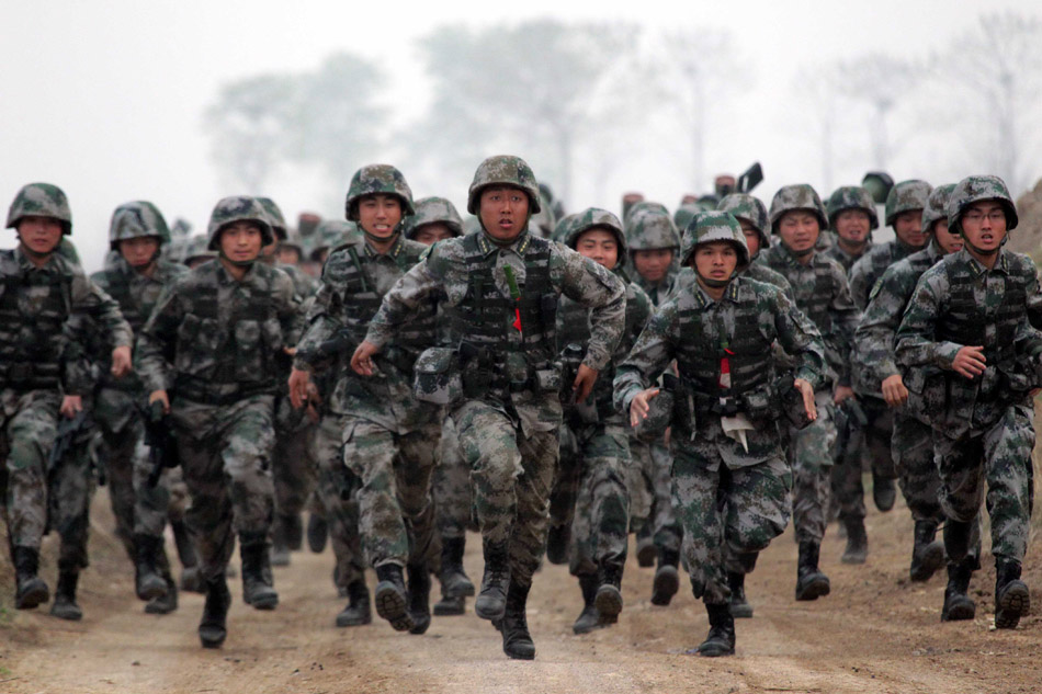 A mechanized infantry brigade of the Beijing Military Region practices armed cross-country exercises. (Xinhua/Zhu Min)