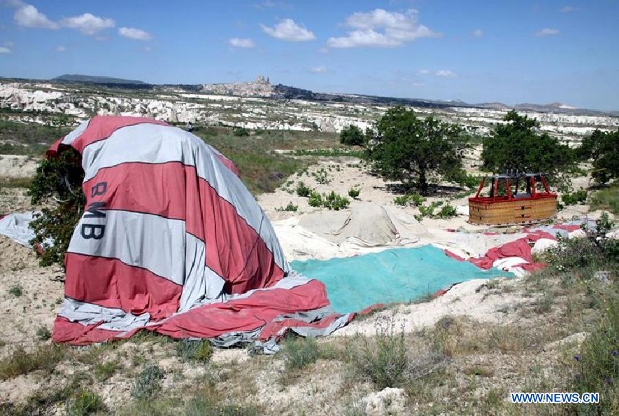 Image taken on May 20, 2013 shows the scene of a hot air balloon collision in Cappadocia, central Turkey. A hot air balloon crashed on Monday morning in central Turkish province of Nevsehir, killing two and injuring 23, Turkish local media reported. (Xinhua/NTV) 