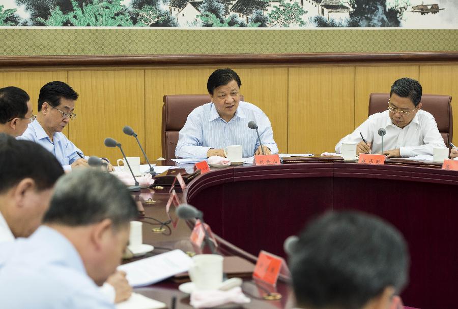 Liu Yunshan (2nd R), a member of the Standing Committee of the Political Bureau of the Communist Party of China (CPC) Central Committee, presides over the first meeting of a leading team of a campaign aimed to strengthen the ties between the CPC and the public, in Beijing, capital of China, May 21, 2013. (Xinhua/Wang Ye)