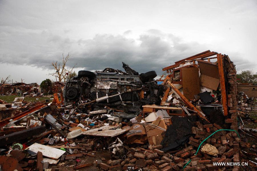 Photo taken on May 21, 2013 shows a view of Moore, Oklahoma, the United States after a tornado. Twenty-four people were killed and 237 others injured when a massive tornado blasted the southern suburbs of Oklahoma City, the capital of the U.S. state of Oklahoma, on Monday, state officials said Tuesday. (Xinhua/Song Qiong) 
