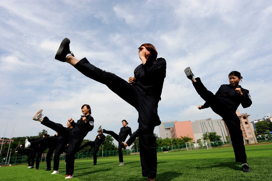 The woman students of Guizhou Police Academy receive training in Guiyang of Guizhou province on May 21, 2013. The students are going to complete their training courses and begin to serve very soon. (Photo/Imagine China)