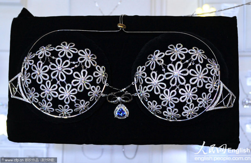 A 10 million-yuan bra is on display in Shenyang, Liaoning province on May 21, 2013. The bra was created by 10 French designers, with 2,500 diamonds and 18k gold. [Photo / CFP] 