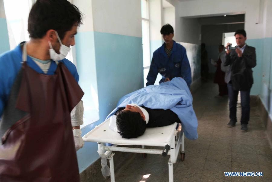 A wounded Afghan receives treatment at a hospital in Ghazni province, east Afghanistan, on May 22, 2013. One Afghan civilian was killed and five others were wounded Wednesday morning when an improvised bomb went off in Ghazni city, the provincial capital of eastern Ghazni province, police said. (Xinhua/Rahmat)