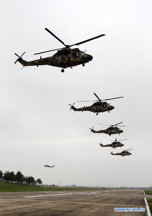 Photo taken on May 20, 2013 shows the South Korea Utility Helicopter (KUH) 'Surion' demonstration flight of maneuver and performance on a media day in Nonsan city, Choongcheongnamdo province of South Korea. (Xinhua/Park Jin hee)