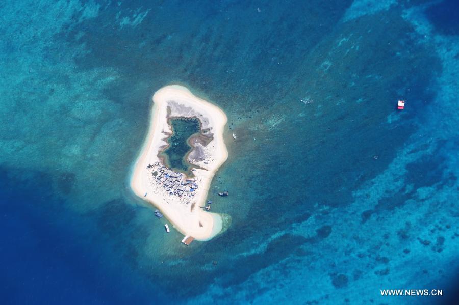 Photo taken on May 20, 2013 shows the scenery of a village on the Jinqing Island of Yongle Islands in Sansha City, south China's Hainan Province. (Xinhua/Zha Chunming)