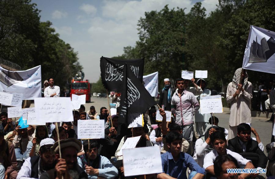 Afghan university students attend a protest against the Elimination of Violence against Women (EVAW) law, in Kabul Afghanistan on May 22, 2013. The protesters said parts of the EVAW law, endorsed by Afghan President Hamid Karzai in 2009, are against Islamic teaching. The law has yet to be ratified by the parliament. (Xinhua/Ahmad Massoud)
