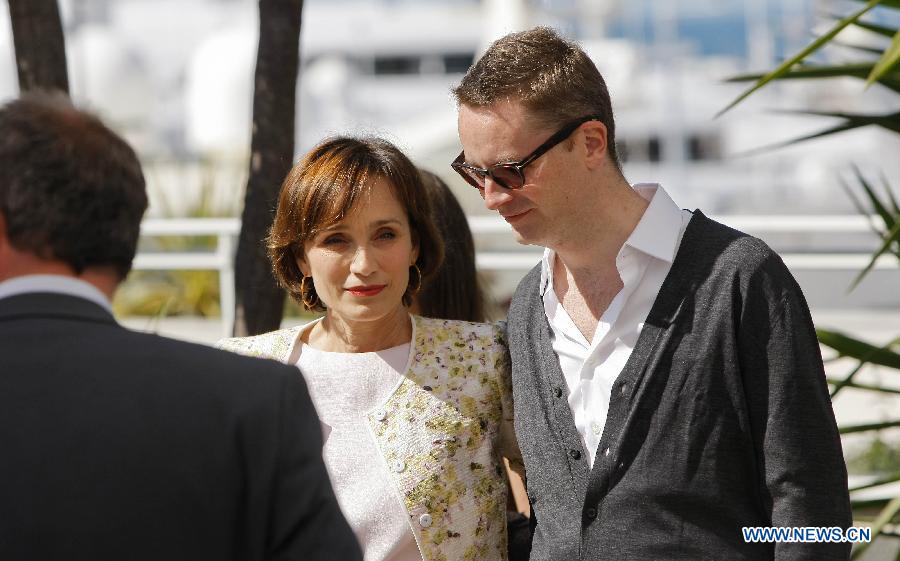 Director Nicolas Winding Refn (R) and actress Kristin Scott Thomas pose during the photocall for the film "Only God Forgives" at the 66th edition of the Cannes Film Festival in Cannes, France, on May 22, 2013. (Xinhua/Zhou Lei) 