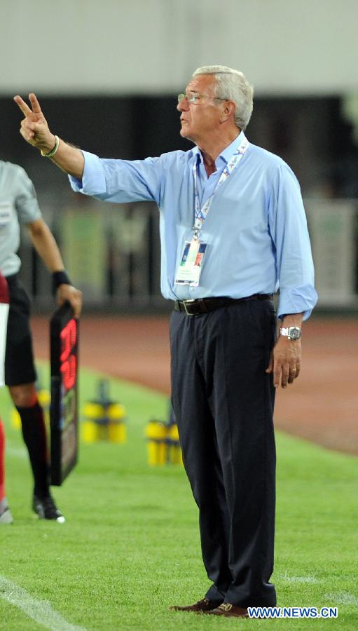 Marcello Lippi, head coach of Guangzhou Evergrande reacts during the AFC Champions League round of 16 second leg match against Central Coast Mariners in Guangzhou, capital of south China's Guangdong Province, May 22, 2013. Guangzhou Evergrande won 3-0 and entered the quarterfinals with an aggregate 5-1. (Xinhua/Liu Dawei)