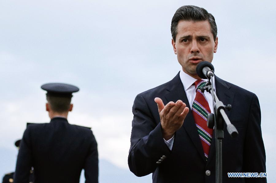 Mexico's President Enrique Pena Nieto delivers a speech upon his arrival at the Alfonso Bonilla Aragon Inernational Airport in the city of Cali, Colombia, on May 22, 2013. Enrique Pena Nieto arrived in Cali to attend the VII Pacific Alliance Summit. (Xinhua/Jhon Paz) 