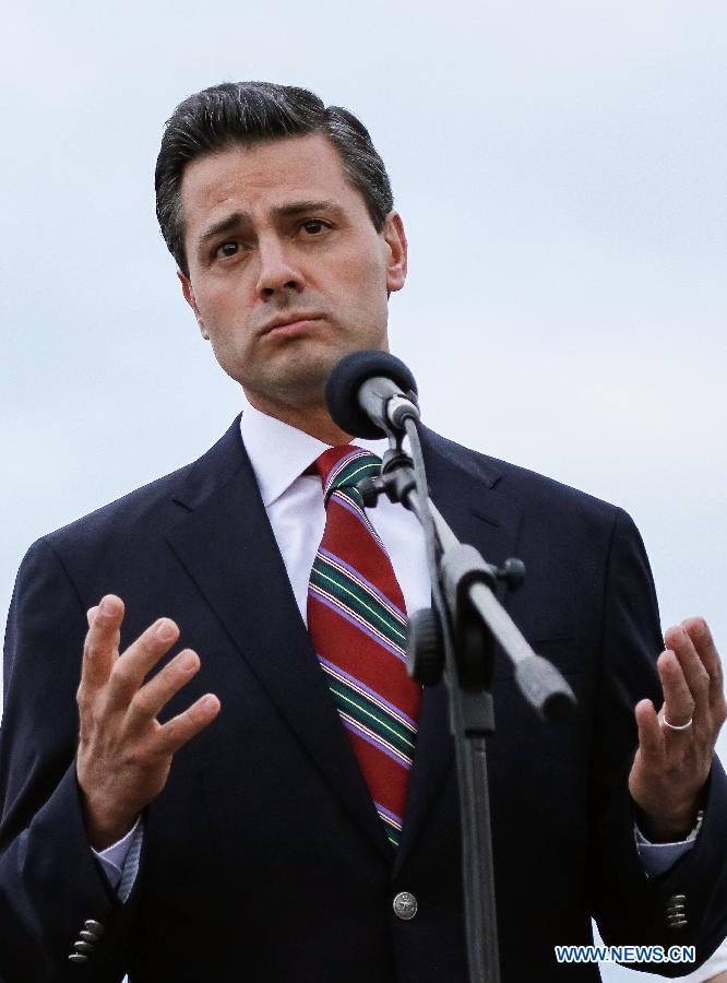 Mexico's President Enrique Pena Nieto delivers a speech upon his arrival at the Alfonso Bonilla Aragon Inernational Airport in the city of Cali, Colombia, on May 22, 2013. Enrique Pena Nieto arrived in Cali to attend the VII Pacific Alliance Summit. (Xinhua/Jhon Paz) 