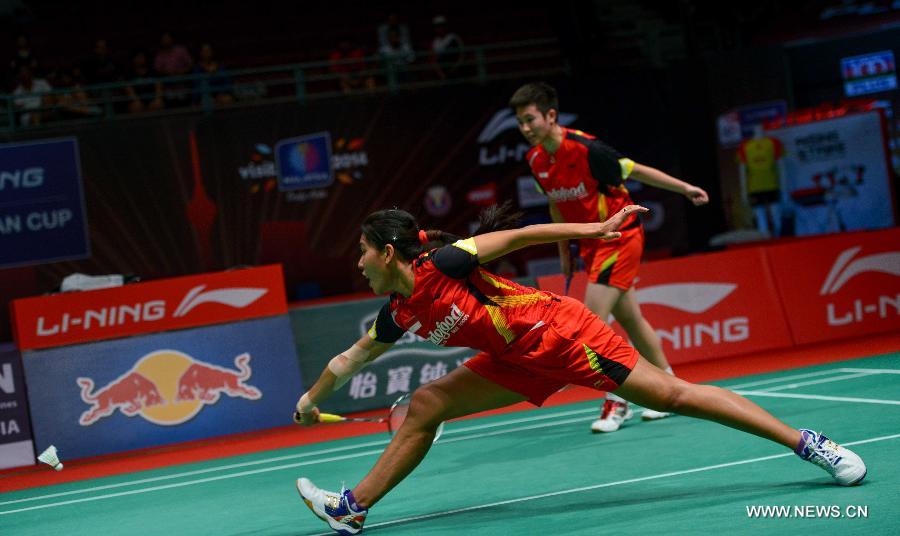 Indonesia's Natsir Liliyana and Maheswari Nitya Krishinda (L) compete during the women's doubles badminton match against China's Yu Yang and Wang Xiaoli at the quarterfinals of the Sudirman Cup World Team Badminton Championships in Kuala Lumpur, Malaysia, on May 23, 2013. Indonesia lost 2-3. (Xinhua/Chong Voon Chung)