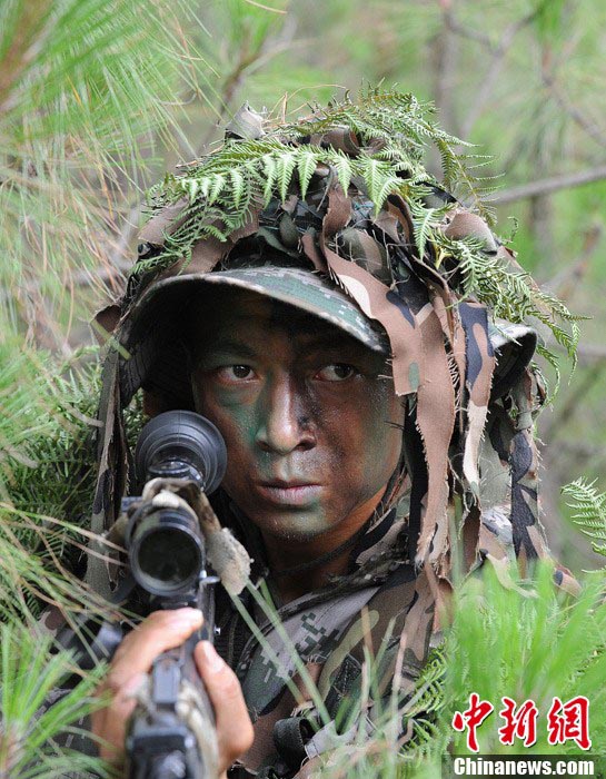 Snipers of the Chinese People's Liberation Army (PLA) participate in military training at a base in Chengdu, Southwest China's Sichuan Province, May 22, 2013. Altogether snipers from over 40 troops of more than 10 corps including the army, navy, air force and the Second Artillery Corps took part in the 40-day training that concluded on Wednesday. [Photo: CNS/Wu Sulin] 