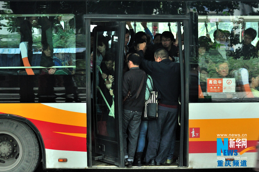 People in a crowded bus in Chongqing. (Xinhua/Li Xiangbo)