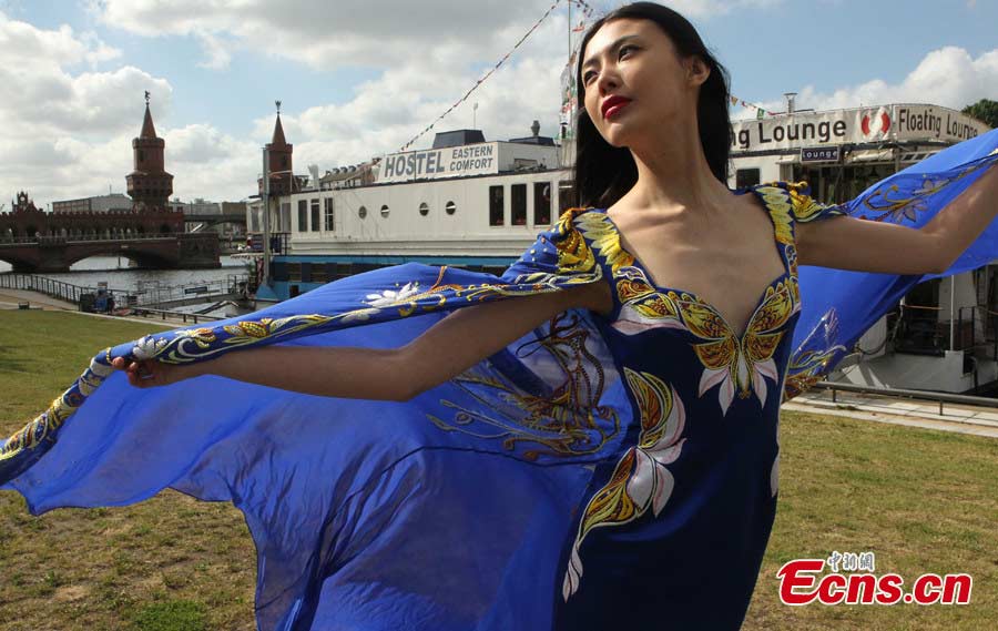 A model presents a "Huafu" dress during the 2013 Berlin Huafu Show in Germany, May 23, 2013. China has a good tradition of great manners, which is called "Xia," while the collection of beautiful dresses of ancientChina, was named "Hua." Huaxia's dress is "Huafu," representing the essence and spirit of China's culture and history. Therefore, "Huafu" is also called China's National Dress. (CNS/Qian Xingqiang)
