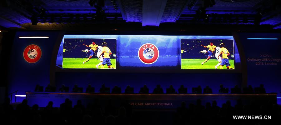 Congress members watch a video ahead of the XXXVII Ordinary UEFA Congress 2013 at Grovesnor House Hotel in London, Britain, on May 24, 2013. (Xinhua/Wang Lili) 