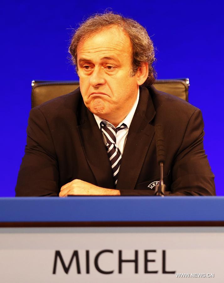 UEFA president Michel Platini (R) addresses the XXXVII Ordinary UEFA Congress 2013 at Grovesnor House Hotel in London, Britain, on May 24, 2013. (Xinhua/Wang Lili) 