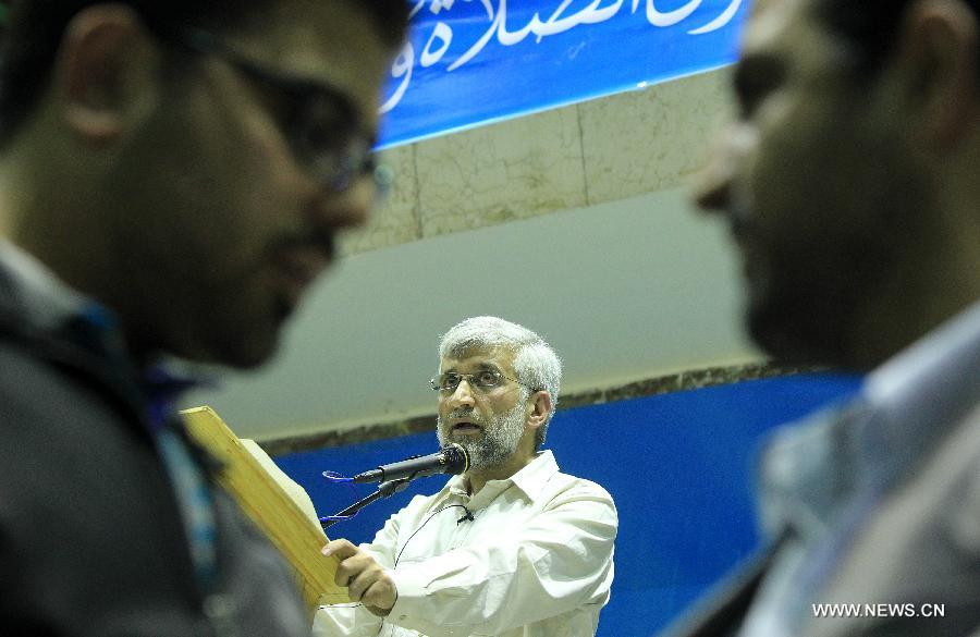 Iran's chief nuclear negotiator and presidential candidate Saeed Jalili (C) speaks during a campaign rally in downtown Tehran, Iran, on May 24, 2013. Iran's Guardian Council of Constitution announced the names of eight eligible candidates for the upcoming presidential election while barring two major political figures from running for presidency. (Xinhua/Ahmad Halabisaz) 