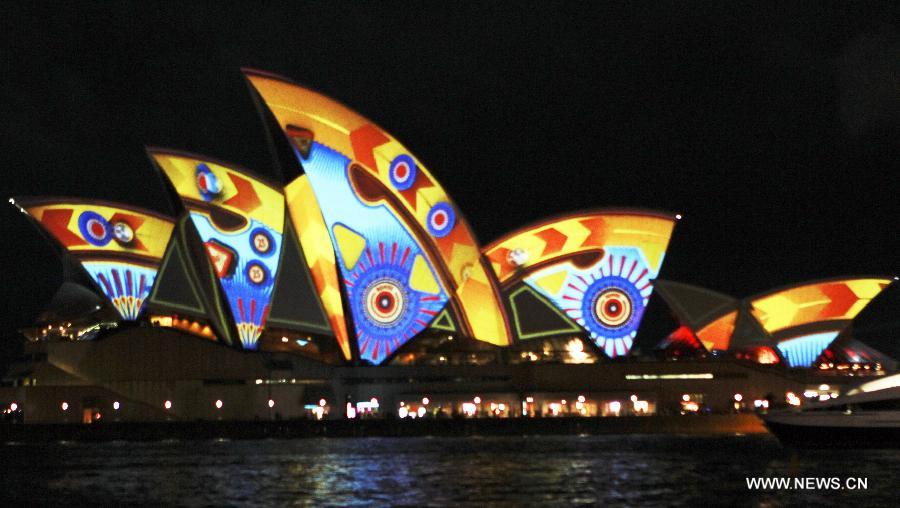 The Opera House is lit up during the Vivid Sydney, a festival of light, music and ideas, in Sydney, Australia, May 24, 2013. (Xinhua/Jin Linpeng) 