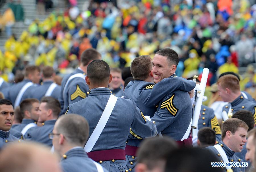 Graduating cadets celebrate with a hug during the graduation ceremonies at the United States Military Academy at West Point, New York, the United States, May 25, 2013. 1,007 cadets graduated on Saturday from the famous military academy founded in 1802. (Xinhua/Wang Lei)