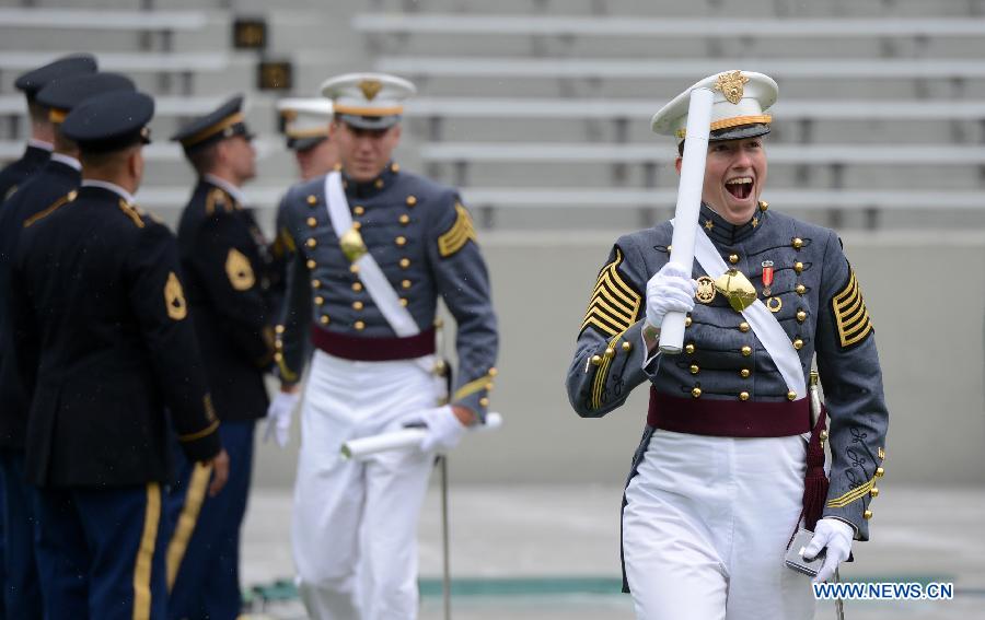 A graduating cadet reacts after receiving his diploma during the graduation ceremonies at the United States Military Academy at West Point, New York, the United States, May 25, 2013. 1,007 cadets graduated on Saturday from the famous military academy founded in 1802. (Xinhua/Wang Lei)