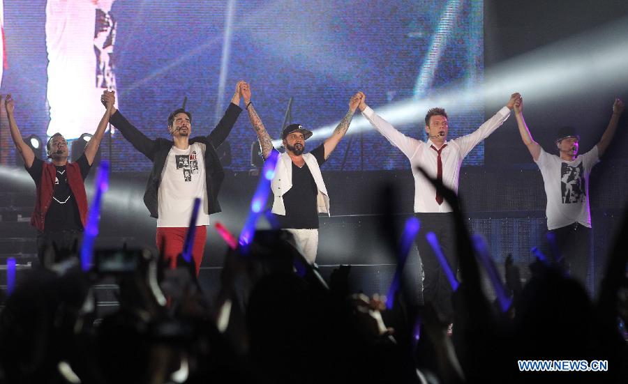 American vocal group Backstreet Boys show their appreciation to their fans after their 2013 world tour concert at the MasterCard Center in Beijing, capital of China, May 25, 2013. This year marks the 20th anniversary of the founding of the group. (Xinhua/Yang Le)