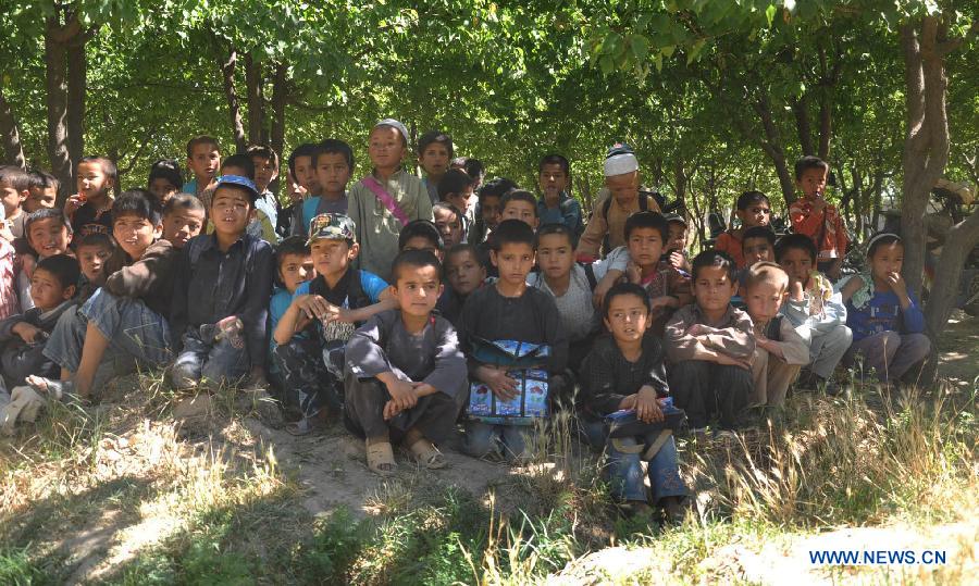 Afghan boys have a class at a school in Jawzjan province, Afghanistan, on May 26, 2013. Some 8.4 million students, 39 percent of them girls, now go to school in the post-Taliban Afghanistan, according to officials. (Xinhua/Arui) 