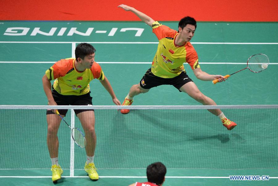 Liu Xiaolong (R) and Qiu Zihan of China compete during the men's doubles match against South Korea's Ko Sung Hyun/Lee Yong Dae at the finals of the Sudirman Cup World Team Badminton Championships in Kuala Lumpur, Malaysia, on May 26, 2013. Team China won the champion with 3-0. (Xinhua/Chen Xiaowei)
